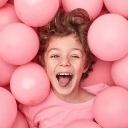 excited-kid-playing-balloons-251859-14382-6624a93bb319d