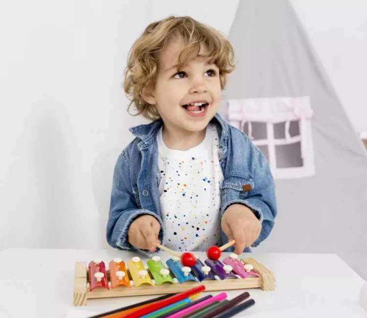 front-view-boy-playing-with-xylophone-23-2148572928-6624a5956a929